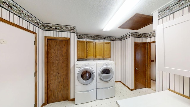 1930 Wilby Rd, Albert Lea, MN 56007 - washroom featuring wallpapered walls, cabinet space, light floors, independent washer and dryer, and a textured ceiling