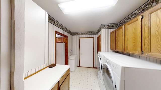 1930 Wilby Rd, Albert Lea, MN 56007 - laundry area with cabinet space, light floors, separate washer and dryer, and wallpapered walls
