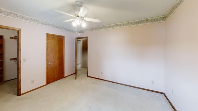 1930 Wilby Rd, Albert Lea, MN 56007 - unfurnished bedroom featuring light carpet, a closet, and a ceiling fan