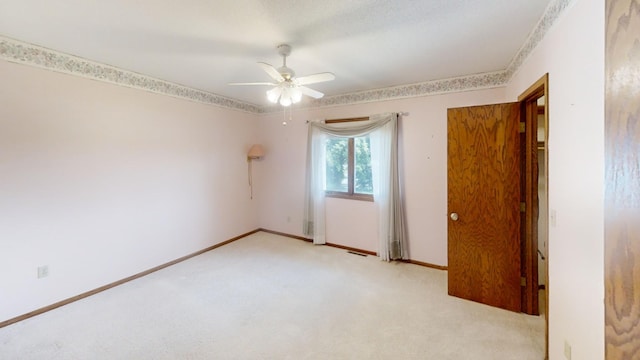 1930 Wilby Rd, Albert Lea, MN 56007 - unfurnished bedroom with light colored carpet and ceiling fan
