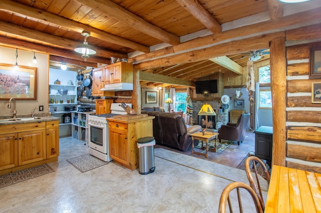 31759 County 30, Laporte, MN 56461 - kitchen with white gas range, under cabinet range hood, open floor plan, a wood ceiling with exposed beams, and a brick fireplace
