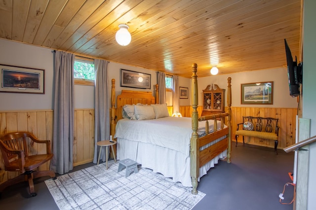 31759 County 30, Laporte, MN 56461 - bedroom with wainscoting, wood ceiling, finished concrete flooring, and wooden walls