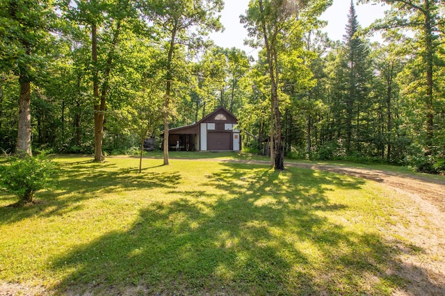 31759 County 30, Laporte, MN 56461 - view of grassy yard with a detached garage, an outbuilding, a view of trees, a pole building, and driveway