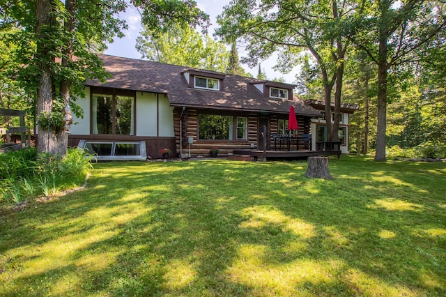 31759 County 30, Laporte, MN 56461 - back of house with log exterior, a wooden deck, roof with shingles, and a yard