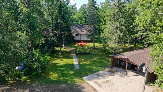 31759 County 30, Laporte, MN 56461 - view of grassy yard with concrete driveway and a carport