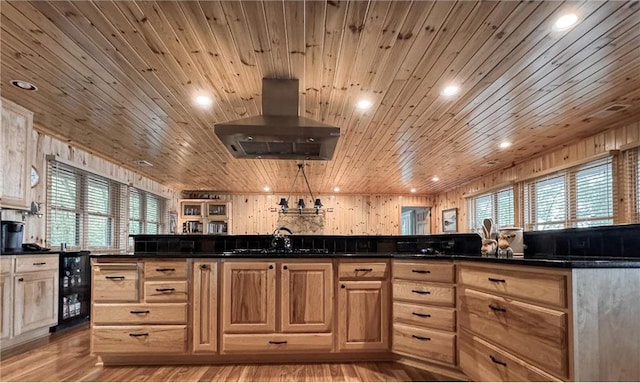 7310 Moose Lake Rd NE, Blackduck, MN 56630 - kitchen featuring range hood, beverage cooler, wooden ceiling, dark countertops, and plenty of natural light