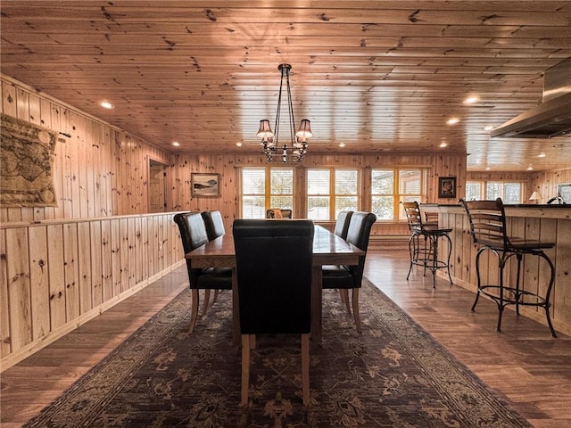 7310 Moose Lake Rd NE, Blackduck, MN 56630 - dining room with wooden ceiling, plenty of natural light, a chandelier, wooden walls, and wood finished floors