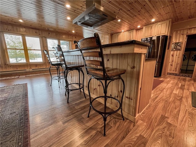7310 Moose Lake Rd NE, Blackduck, MN 56630 - kitchen with freestanding refrigerator, wood ceiling, extractor fan, healthy amount of natural light, and light wood finished floors