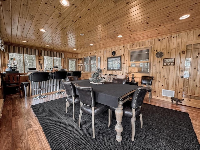 7310 Moose Lake Rd NE, Blackduck, MN 56630 - dining area featuring healthy amount of natural light, wood walls, wood ceiling, wood finished floors, and recessed lighting