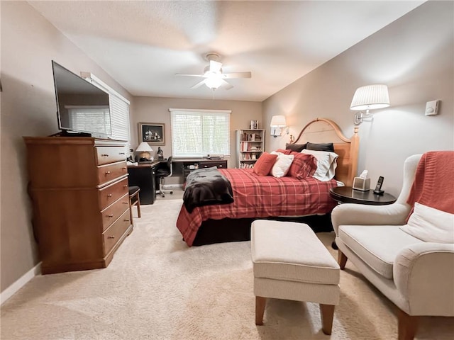7310 Moose Lake Rd NE, Blackduck, MN 56630 - bedroom with light colored carpet, an office area, and a ceiling fan