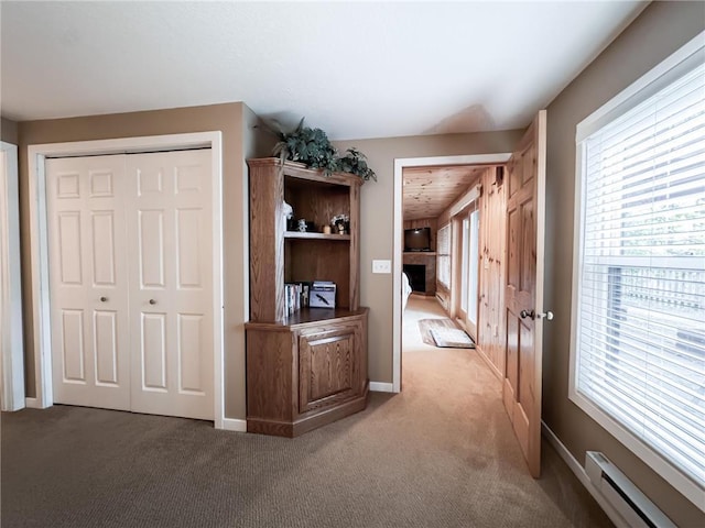 7310 Moose Lake Rd NE, Blackduck, MN 56630 - corridor with a baseboard radiator and carpet floors