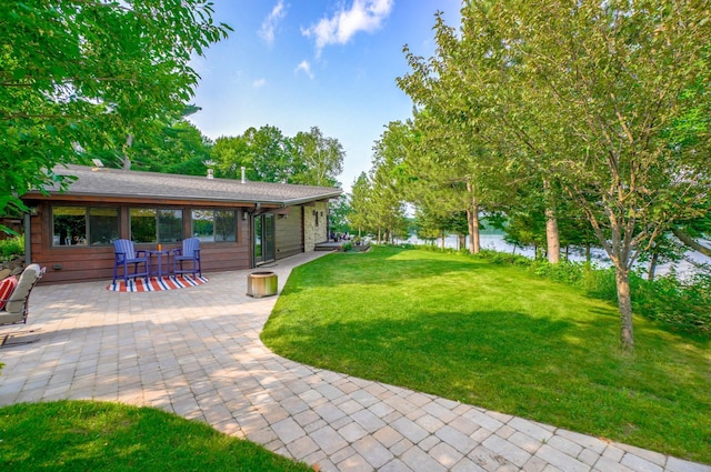 16267 Conners Ln, Sand Lake Twp, WI 54876 - view of grassy yard featuring a patio and a water view