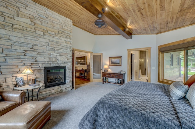 16267 Conners Ln, Sand Lake Twp, WI 54876 - bedroom with a wood ceiling with exposed beams, carpet flooring, a stone fireplace, access to exterior, and connected bathroom