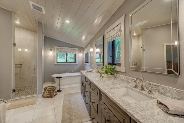 16267 Conners Ln, Sand Lake Twp, WI 54876 - full bath with vaulted ceiling, a shower stall, a freestanding tub, tile patterned floors, and double vanity