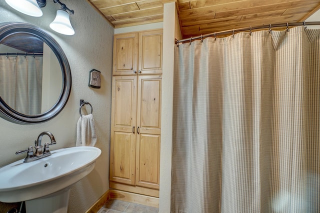 16267 Conners Ln, Sand Lake Twp, WI 54876 - bathroom with a textured wall, wooden ceiling, and a shower with curtain