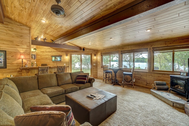16267 Conners Ln, Sand Lake Twp, WI 54876 - carpeted living area featuring a wood stove, wooden ceiling, wooden walls, lofted ceiling, and recessed lighting