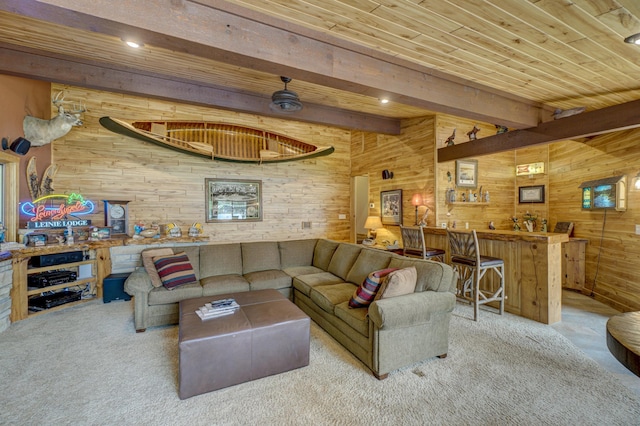 16267 Conners Ln, Sand Lake Twp, WI 54876 - carpeted living room featuring wood walls, a wooden ceiling with exposed beams, and bar