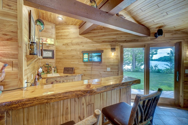 16267 Conners Ln, Sand Lake Twp, WI 54876 - indoor bar featuring wooden walls, stone tile floors, and wooden ceiling