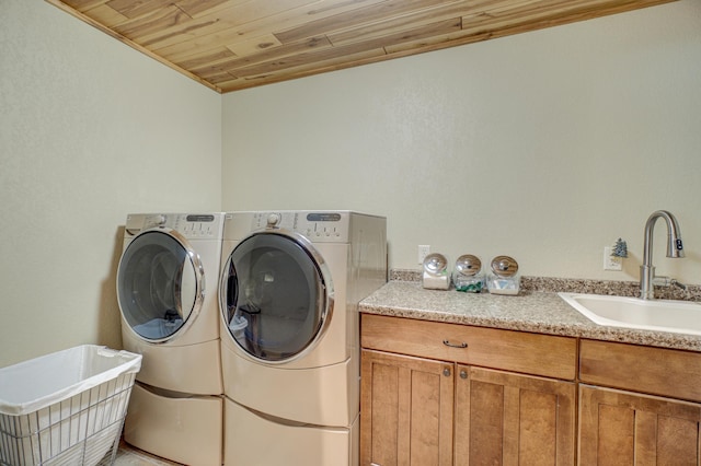 16267 Conners Ln, Sand Lake Twp, WI 54876 - laundry room with washer and clothes dryer, wood ceiling, and cabinet space