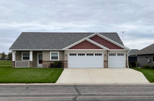 307 14th St N, Cold Spring, MN 56320 - craftsman inspired home with an attached garage, a front yard, roof with shingles, and concrete driveway