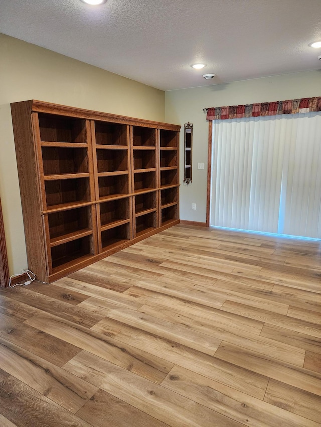 307 14th St N, Cold Spring, MN 56320 - unfurnished room featuring wood finished floors, recessed lighting, and a textured ceiling