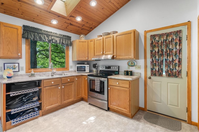 20592 Lehmicke Ln, Trade Lake, WI 54853 - kitchen featuring stainless steel electric stove, under cabinet range hood, a skylight, white microwave, and recessed lighting