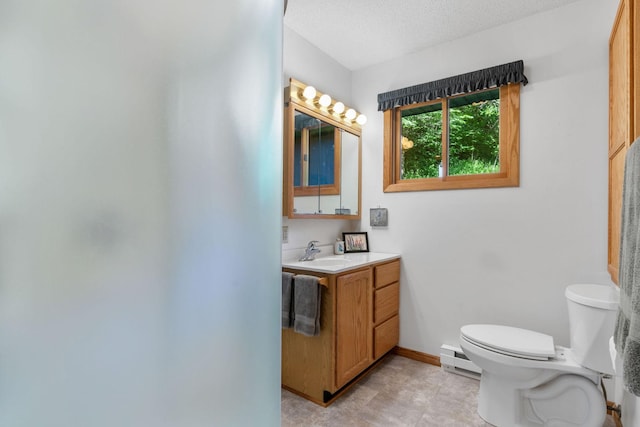 20592 Lehmicke Ln, Trade Lake, WI 54853 - bathroom with vanity, a baseboard heating unit, and a textured ceiling