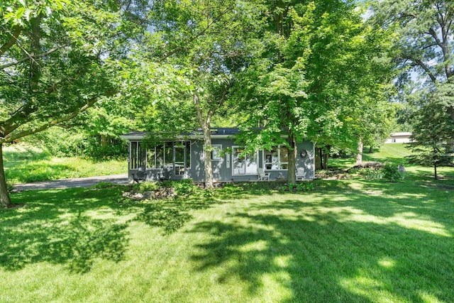 20592 Lehmicke Ln, Trade Lake, WI 54853 - view of green lawn with a sunroom