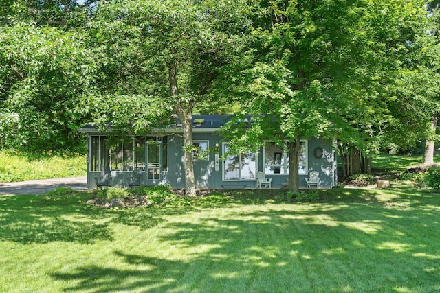 20592 Lehmicke Ln, Trade Lake, WI 54853 - view of front of house with a front lawn and a sunroom