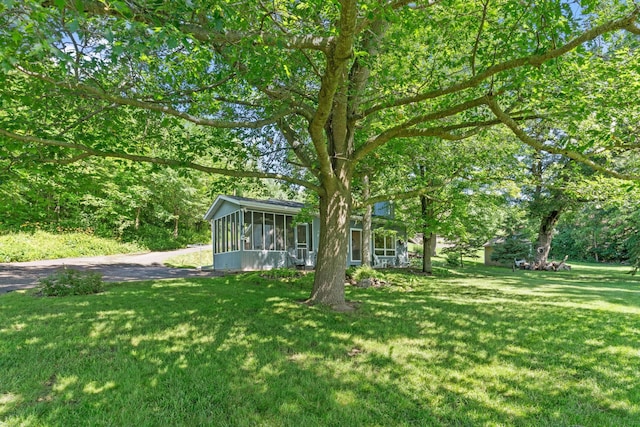20592 Lehmicke Ln, Trade Lake, WI 54853 - view of green lawn featuring a sunroom