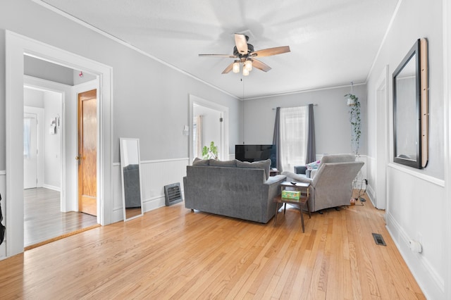 218 11th Ave NE, Rochester, MN 55906 - living room with light wood-style flooring, ceiling fan, and crown molding