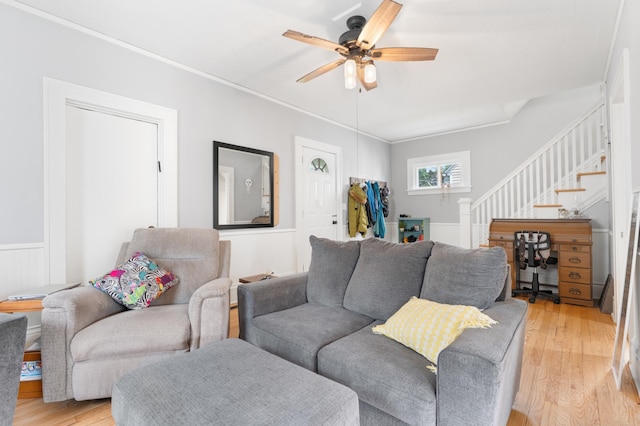 218 11th Ave NE, Rochester, MN 55906 - living room with stairway, a ceiling fan, light wood-style flooring, and crown molding