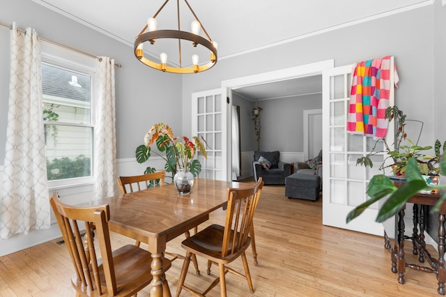 218 11th Ave NE, Rochester, MN 55906 - dining area with a chandelier, crown molding, light wood-type flooring, and french doors