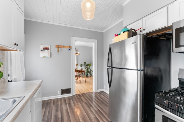 218 11th Ave NE, Rochester, MN 55906 - kitchen featuring appliances with stainless steel finishes, white cabinetry, dark wood finished floors, light countertops, and wooden ceiling