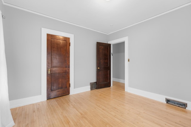 218 11th Ave NE, Rochester, MN 55906 - empty room with wood-type flooring and crown molding