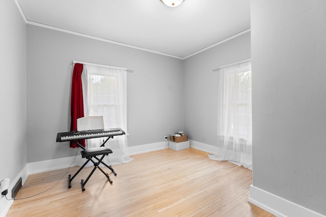 218 11th Ave NE, Rochester, MN 55906 - miscellaneous room featuring ornamental molding, healthy amount of natural light, and wood finished floors