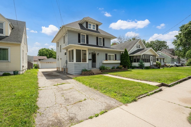 218 11th Ave NE, Rochester, MN 55906 - american foursquare style home with an outbuilding, a detached garage, board and batten siding, a front yard, and roof with shingles