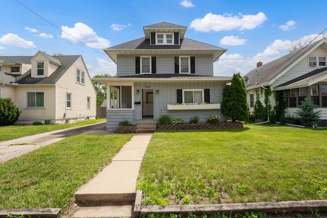 218 11th Ave NE, Rochester, MN 55906 - american foursquare style home featuring roof with shingles, a front lawn, and board and batten siding