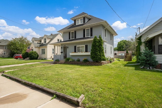 218 11th Ave NE, Rochester, MN 55906 - traditional style home with board and batten siding, a front lawn, and a shingled roof