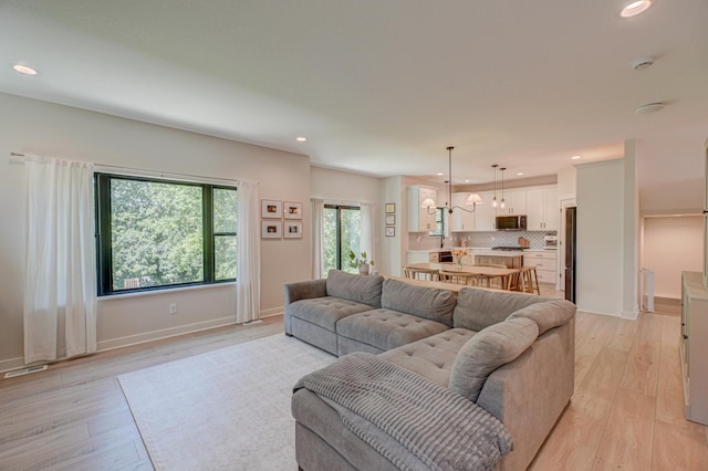 21 Windsor Wood Path, Hudson, WI 54016 - living room featuring recessed lighting and light wood-type flooring