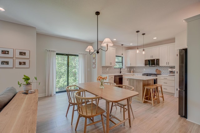 21 Windsor Wood Path, Hudson, WI 54016 - dining area with light wood-type flooring and recessed lighting