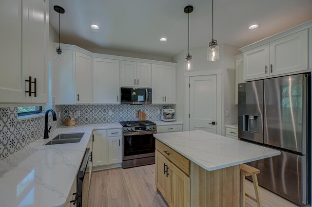 21 Windsor Wood Path, Hudson, WI 54016 - kitchen featuring stainless steel appliances, light wood-style floors, backsplash, white cabinets, and recessed lighting