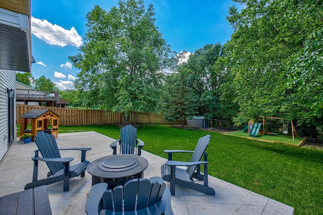 21 Windsor Wood Path, Hudson, WI 54016 - fenced backyard with a playground, a patio, and a fire pit