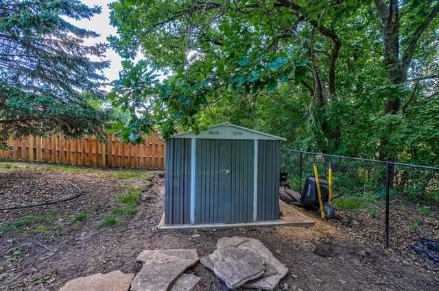 21 Windsor Wood Path, Hudson, WI 54016 - fenced backyard with a storage unit