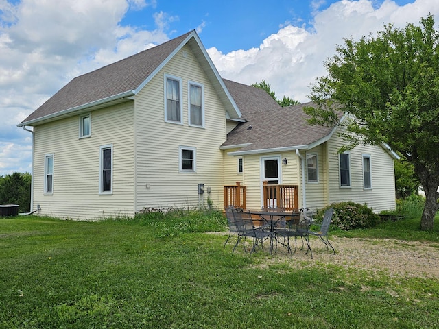 86389 245th St, Albert Lea, MN 56007 - back of property featuring a shingled roof and a yard