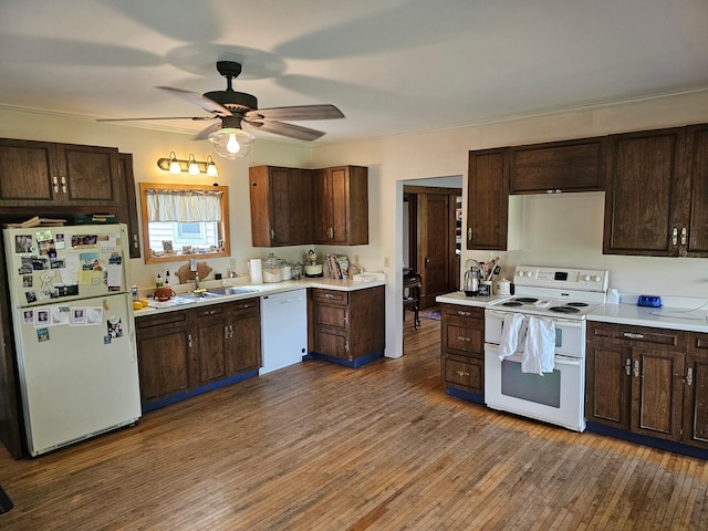 86389 245th St, Albert Lea, MN 56007 - kitchen featuring white appliances, light countertops, dark brown cabinetry, wood finished floors, and a ceiling fan