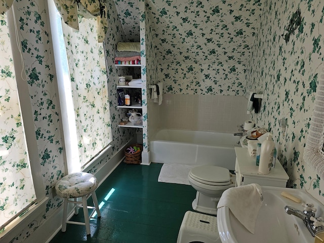 86389 245th St, Albert Lea, MN 56007 - bathroom with wallpapered walls, wood finished floors, and washtub / shower combination