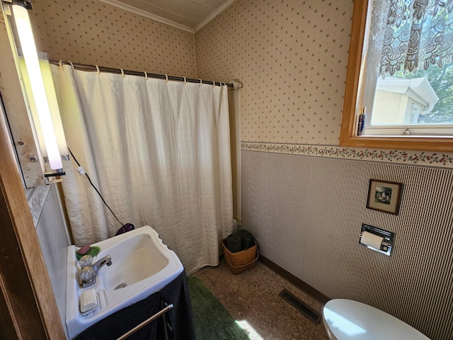 86389 245th St, Albert Lea, MN 56007 - bathroom with wallpapered walls, ornamental molding, a shower with curtain, and wainscoting