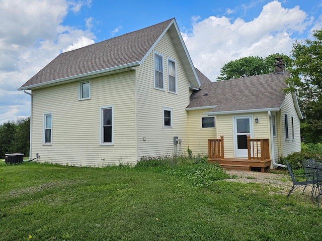 86389 245th St, Albert Lea, MN 56007 - rear view of property with roof with shingles, a lawn, and a chimney