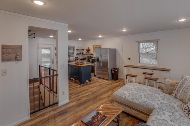 36722 Birch Dr, Jenkins Twp, MN 56474 - living room featuring light wood-style flooring, healthy amount of natural light, recessed lighting, and ornamental molding